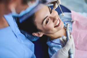 woman smiling during fluoride treatments in TX