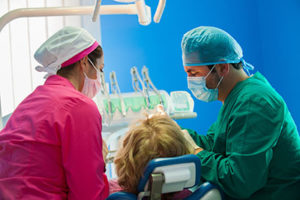 doctors performing oral surgery