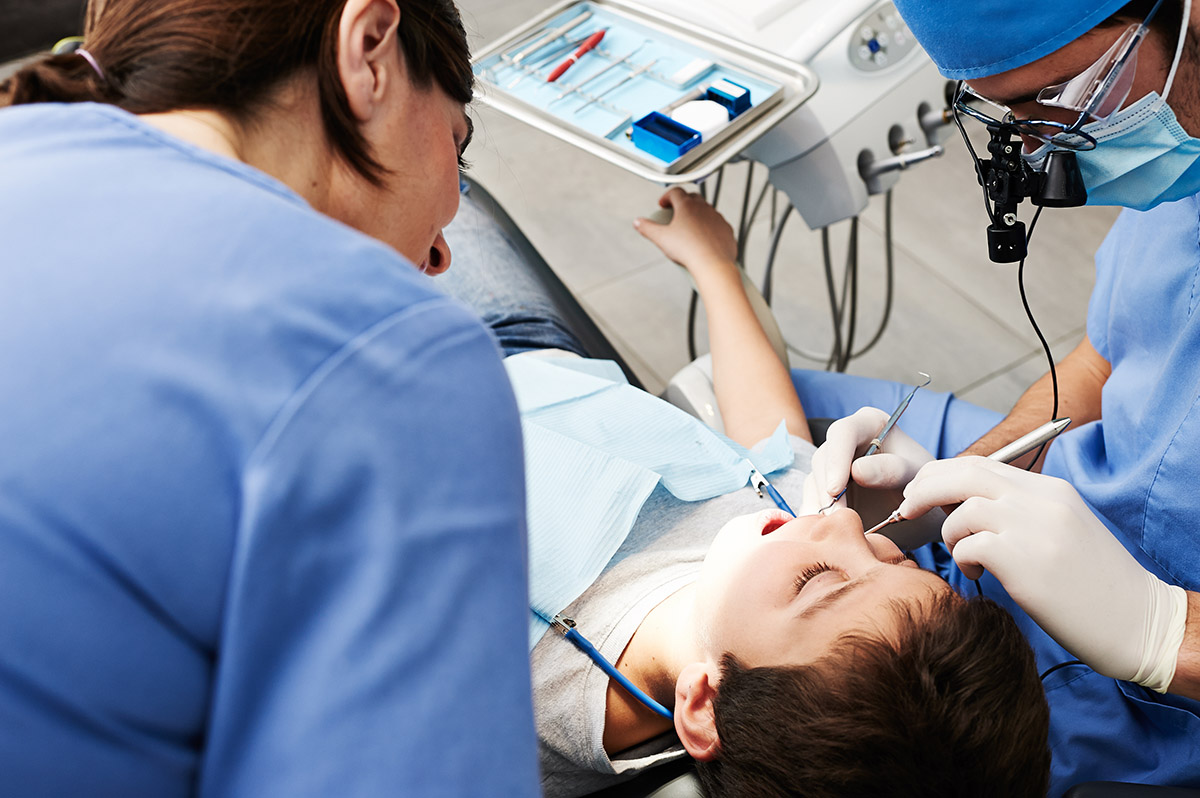 child getting treatment for a pediatric dental emergency