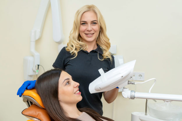 teeth whitening options (1) dentist showing a patient teeth whitening options