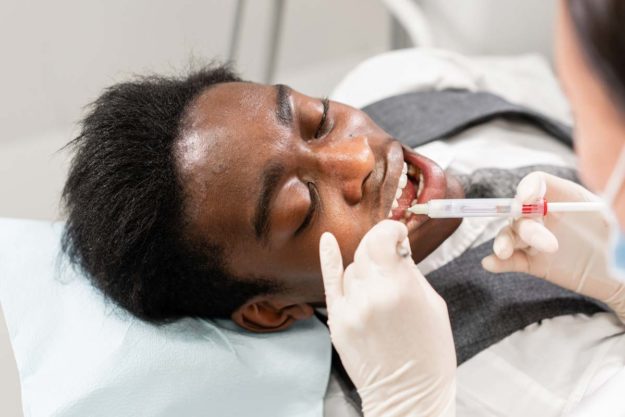 patient getting treatment for dental emergencies