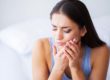 woman experiencing tooth pain