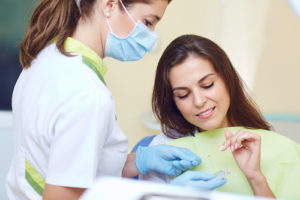 Woman looked at the details of her dental crowns