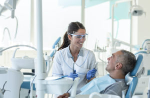 Dr. prepares patient for a root canal