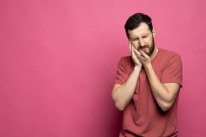 man suffering from teeth grinding