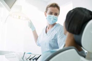 doctor prepares for emergency dental treatment