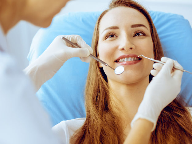3 Benefits of Adult Orthodontic Services woman learning about adult orthodontics