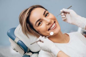 woman visiting a speciality dentist and learning about speciality dentistry services